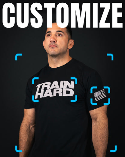 Customizeable Tees from Train Hard. Image shows a man wearing a black t-shirt with 'TRAIN HARD' text on a dark background